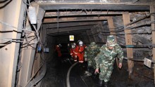 Rescuers race against time to pump water from a flooded coal mine where 22 miners were trapped underground on April 7, 2014 in Qujing, Yunnan Province of China.
