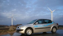In this handout photo provided by Project Better Place on May 11, 2008, Renault's electric car, built on the Megane model, is parked nearby wind turbines in Denmark. 