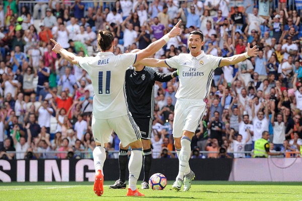 Real Madrid forward Cristiano Ronaldo (R) celebrates with teammate Gareth Bale after scoring a goal