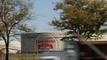 A truck passes by the Exxon Mobil refinery November 1, 2007 in Joliet, Illinois.