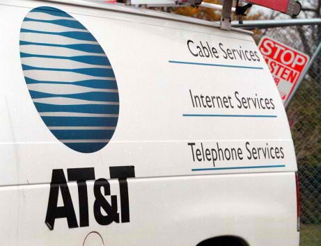 The AT&T logo is seen on the side of a service van in Des Plaines, Illinois. 