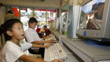 Thai youngsters play in a cyber game shop on July 16, 2003 in Bangkok, Thailand.