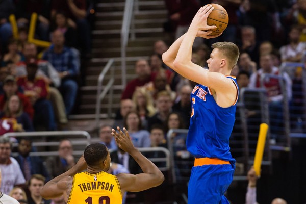 New York Knicks power forward Kristaps Porzingis (R) shoots over Cleveland Cavaliers' Tristan Thompson