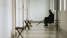  A senior citizen sits at the corridor of a care center on May 22, 2007 in Zibo of Shandong Province, China.