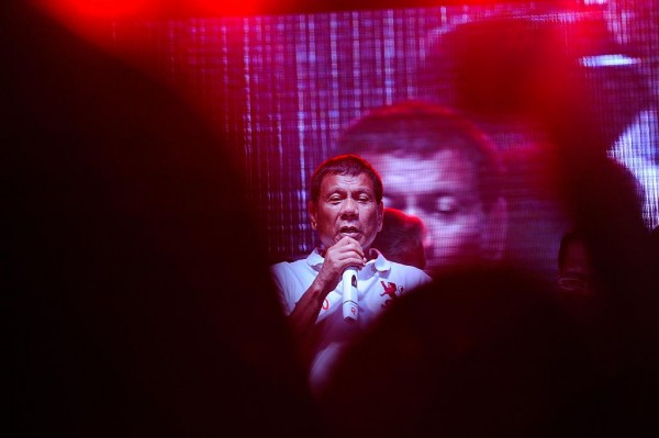 Philippine presidential candidate Rodrigo Duterte gestures during a labor day campaign rally on May 1, 2016 in Manila, Philippines. 