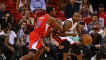 Miami Heat power forward Chris Bosh (R) posts up against Los Angeles Clippers' DeAndre Jordan