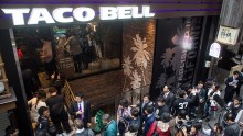 People wait outside the new Taco Bell store ahead of it's official opening on April 21, 2015 in Tokyo, Japan.