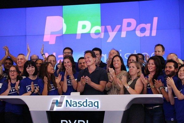 PayPal President and CEO Dan Schulman (center) joins employees, customers and Nasdaq employees while ringing the bell at Nasdaq this morning on July 20, 2015 in New York City.