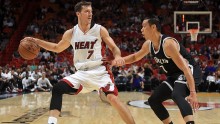 Miami Heat point guard Goran Dragic dribbles away from Brooklyn Nets' Jeremy Lin