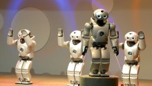  Sony's SDR-4X II robots perform on a stage at Robodex2003 April 2, 2003 in Yokohama, Japan.