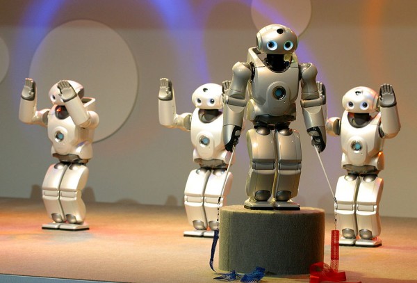  Sony's SDR-4X II robots perform on a stage at Robodex2003 April 2, 2003 in Yokohama, Japan.