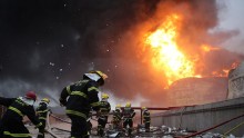  Firefighters battle a fire at the explosion site of PX chemical plant on April 7, 2015 in Zhangzhou, China.