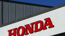The Honda logo is seen on the outside of a building at the Honda car assembly plant following the announcement that the firm is to axe 800 jobs on January 11, 2013 in Swindon, England. 