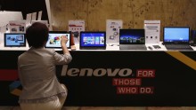A woman tries a Lenovo tablet 