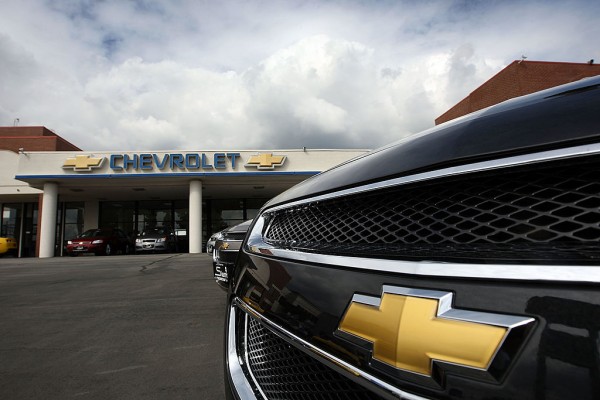  General Motors cars are displayed at the Sierra Chevrolet auto dealership as storm clouds build in the distance on March 2, 2010 in Monrovia, California.