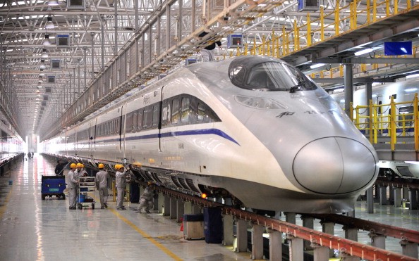  Mechanics check a high-speed train at Xi'an Electric Multiple Unit Maintenance Base on January 7, 2014 in Xi An, China. 