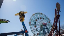 People ride amusement park rides at Coney Island on March 29, 2015 in New York City.