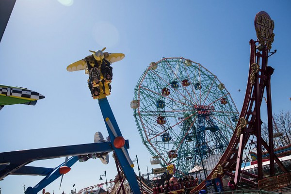 People ride amusement park rides at Coney Island on March 29, 2015 in New York City.