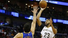 New Orleans Pelicans center Anthony Davis (R) shoots over Golden State Warriors' Zaza Pachulia
