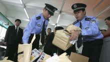 Chinese bust fake documents and prepare to destroy them 