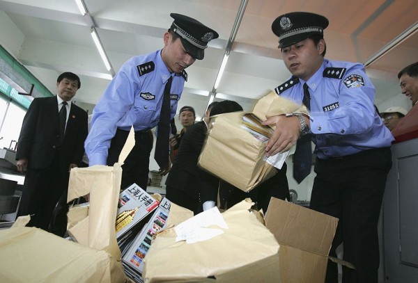 Chinese bust fake documents and prepare to destroy them 