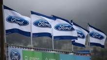  Flags with the Ford logo are posted in front of Serramonte Ford on April 28, 2015 in Colma, California