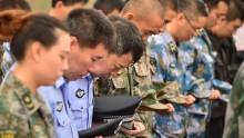 Representatives of People's Liberation Army and public security mourn