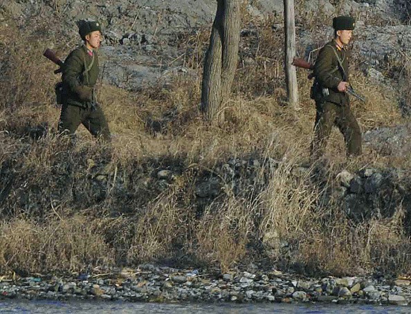 North Korean soldiers near their country's border with China.